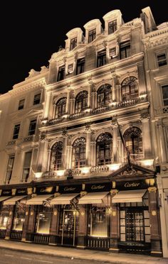 an old building is lit up at night