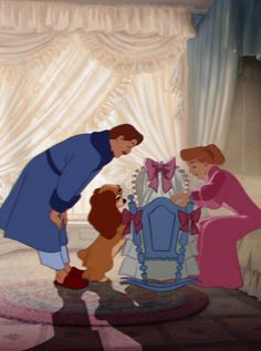 an animated image of a man and woman with two dogs in front of a bed