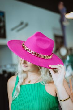 Hot Pink Chained Western Hat You know what made you look! It's that great cable chain accent on our Hot Pink Chained Western Hat. This is the classic wide brim cowgirl style hat in the season's trendiest color - hot pink! Channel your inner cowgirl with the 3 1/2" brim and pinch front crown. Channel your trendsetter vibe because it's hot pink and has a 1" cable chain for that glitz you need and want! Go ahead. Indulge yourself in the Western hat craze! Love it and need more? Check out our Mint t Trendy Wide Brim Fedora For Country Events, Trendy Short Brim Fedora For Country Events, Trendy Fedora With Short Brim For Country Events, Trendy Fedora For Country Events With Short Brim, Trendy Flat Brim Fedora For Country Events, Trendy Winter Hat Bands, Trendy Fedora For Kentucky Derby, Trendy Hat Bands For Country Events In Spring, Trendy Gold Fedora Hat