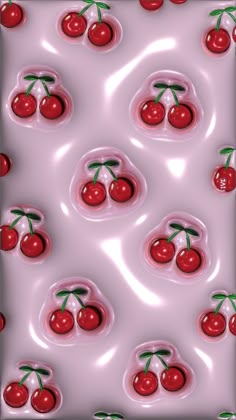 the cherry pattern is made up of many cherries on pink liquid with green stems