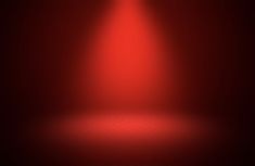 an image of a red light in the dark room with spot lighting on it's side