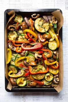 a pan filled with vegetables on top of a table