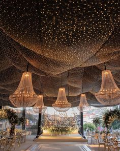 the ceiling is decorated with lights and chandeliers