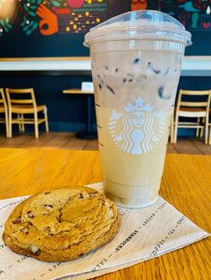 a cup of coffee and some cookies on a table