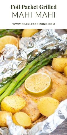 foil packet grilled mahi mahi with potatoes and asparagus on the side