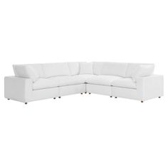 a white sectional couch on a white background