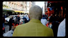 a man standing in the middle of a crowded street