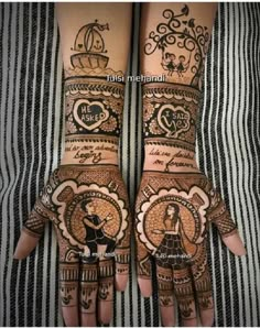 two hands with henna designs on them