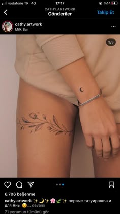 a woman's arm with a tattoo on the side of her leg and an arrow