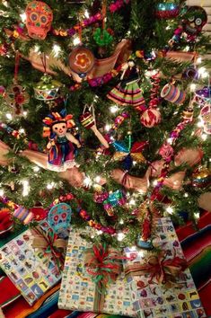 a decorated christmas tree with presents under it