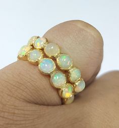 -PRODUCT TYPE - GOLD VERMEIL ETHIOPIAN OPAL RING -MATERIAL - SILVER -PURITY - 925 -TOTAL WEIGHT - 5.500 GRAMS - SILVER WEIGHT - 4.400 GRAMS - STONE WEIGHT - 5.50 CARAT - STONE SIZE - 4.5 MM 18K Yellow Gold Vermeil Ethiopian Opal Ring: Minimal & Simple, Dainty Handmade Yellow Gold Vermeil Bands. Rustic, Understated Luxury. - Delicate Handmade Yellow gold Vermeil ring. - Made to order, just for you. Anirudh Gems Store :- https://www.etsy.com/uk/shop/ANIRUDHGEMSStore?ref=search_shop_redirect We Gold Stackable Opal Promise Ring, Gold Opal Stackable Ring With Oval Shape, Stackable Opal Ring In Yellow Gold For Anniversary, Gold Stackable Opal Ring Gift, Spiritual Gold Round Opal Ring, Stackable Yellow Gold Opal Ring For Anniversary, Spiritual Gold Opal Ring, Ethiopian Opal Fine Jewelry Ring, Gold Spiritual Opal Ring