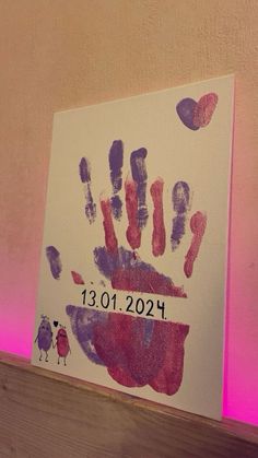 a handprint is displayed on a wall