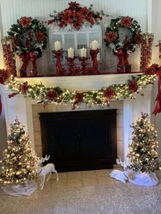 a fireplace decorated for christmas with red and white decorations