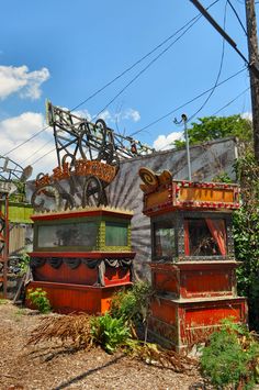 an old train car sitting in front of a building with graffiti on it's side