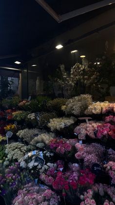 a flower shop filled with lots of different types of flowers