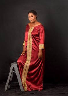 Burgundy African Women Plus Oversized Kaftan Handmade Ready to wear Burgundy satin material with gold mesh accent Perfect African/Nigerian women's attire for special occasions (parties, weddings, formal and traditional ceremonies, church) Special orders for large parties available, please contact us Dry clean for best cleaning results One size plus XL/XXL and 3XL/4XL Long Gold Silk Dress, Gold Long Silk Dress, Traditional Long Sleeve Satin Dress, Gold Long Maxi Dress For Festive Occasions, Gold Long Sleeve Thobe For Festive Occasions, Gold Floor-length Thobe For Party, Elegant Gold Agbada For Party, Festive Gold Maxi Length Thobe, Elegant Gold Thobe For Party