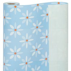 two rolls of blue and white paper with orange polka dots on the bottom one roll is rolled up