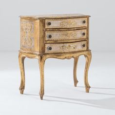 an old wooden dresser with drawers and carvings on the front, sitting against a white background