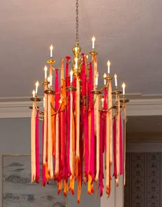 a chandelier hanging from the ceiling in a room