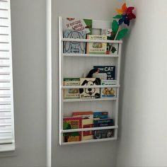 a white book shelf with books on it