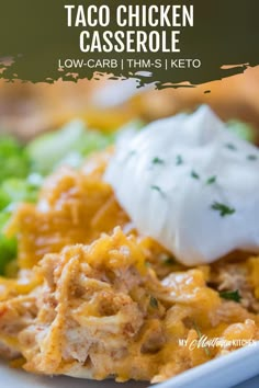 a close up of a plate of food with broccoli and sour cream on top