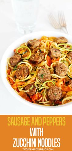 sausage and peppers with zucchini noodles in a white bowl next to a glass of water