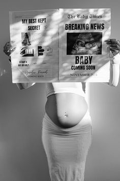 a pregnant woman holding up two newspapers with the words breaking news on it's back