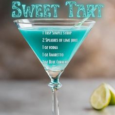 a martini glass with blue liquid in it and the words sweet tart on top