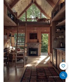 a living room with a ladder to the ceiling and a cat sleeping on top of it