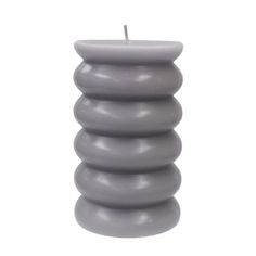 a candle that is sitting in front of a white background