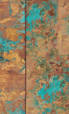 an old rusted metal surface with blue and yellow paint on it, as well as brown