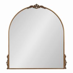 an ornate gold framed mirror on a white background