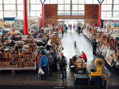 many people are shopping in an open market