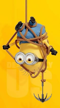 a minion hanging from a rope with two eyes on it's head and one eye