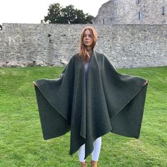 Introducing our Irish Donegal Tweed Wool Ruana, the epitome of luxury, style, and warmth. Handmade in the heart of Ireland, this Speckled Forest Green Herringbone beauty is more than just a garment; it's a statement piece. Here's why you need it in your life: 🌟 **Elegantly Stylish & Wonderfully Versatile Our ruana is designed to elevate your style effortlessly. It wraps you in warmth and luxury, making a statement in town or blending seamlessly into the countryside. Perfect for special occasions or daily wear. 🍂 **All-Season Appeal You don't have to wait for a specific season to flaunt your ruana. From springtime chills to summer evening walks, autumn strolls, and winter winds, it's your go-to choice all year round. ☘️ **Celtic Inspiration Immerse yourself in the timeless style of the Ce Ruana Wrap, Cape Cloak, Donegal Tweed, Killarney, Evening Walk, Wool Cape, Cloak, Shawls And Wraps, Forest Green