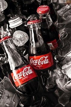 black and white photograph of coca cola bottles