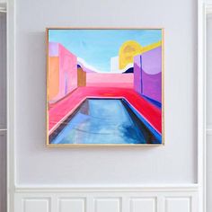 an abstract painting hangs on the wall above a pool in a room with white walls