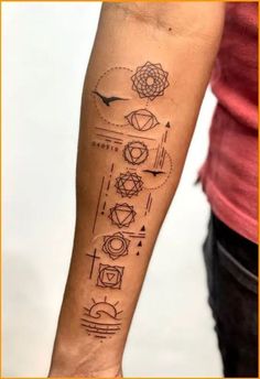 a person with a tattoo on their arm that has different types of symbols in it