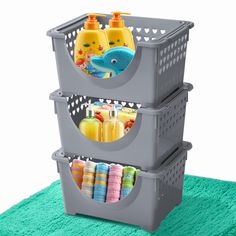 two plastic storage bins stacked on top of each other with soap and toothbrushes in them