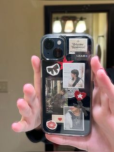 a person holding up a cell phone case with pictures on the front and back of it