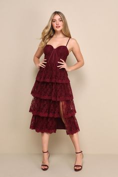 Elevate your entrance with a glamorous look like the Lulus Exceptional Persona Wine Red Lace Tiered Bustier Midi Dress! Airy tulle boasts a lace-like pattern of embroidery as it shapes this darling dress. Adjustable spaghetti straps support a bustier-style bodice with padded cups and supportive boning in an eye-catching, angled pattern. Fitted waist tops a tiered skirt that falls to a midi hem with a flirty side slit. Hidden zipper/clasp at back. Fit: This garment fits true to size. Length: Mid- Hoco Dresses Modest, Marissa Long, Red Hoco Dress, Bustier Midi Dress, Tulle Midi Dress, Red Tour, Lulu Fashion, Red Lace Dress, Red Taylor