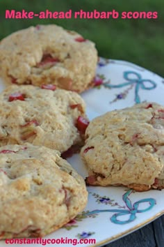 four cookies on a plate with strawberries in the middle