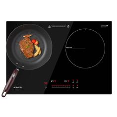 a pan with some food on top of it next to an electric burner oven