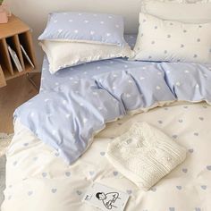 a bed with blue and white polka dots on it