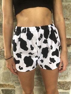 Cow Print Shorts. Great to wear for your next festival. Super cute summer shorts. Super cute and really comfy shorts with a high cut. Made from a 100% cotton fabric with an elastic waist band. Great gift for a birthday, holiday or even a treat for yourself. All of my shorts are made to order so if you have a special request you can leave me a note with your order telling me your exact size specifications. If you don't see your size, if you need the shorts bigger or smaller just tell me and I can Fun Vacation Bottoms With Built-in Shorts, Summer Cotton Bloomers With Elastic Waistband, Trendy Beach Season Pajama Shorts, Cute Cotton Pajama Shorts For Vacation, Summer Festival Shorts, Trendy High-waisted Pajama Shorts For Beach, Casual Shorts For Beach Season Festivals, Trendy Athletic Shorts For Summer, Fun White Shorts For Beach