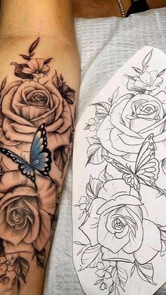 a woman's arm with roses and a butterfly on it