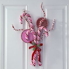 some candy canes are hanging on the door