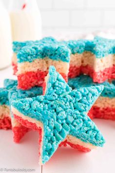 red, white and blue cake that is shaped like stars