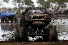 an off road vehicle is driving through mud