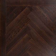 an image of wood flooring that looks like chevron herringbones in dark brown